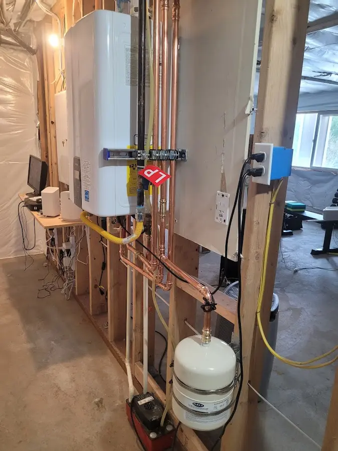 Licensed plumber repairing a kitchen sink in Shelley